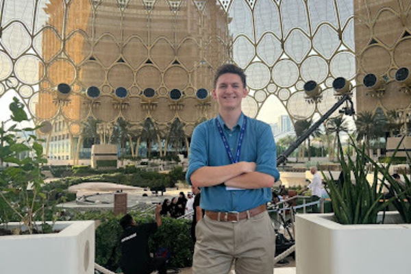 garrett standing in front of expo city