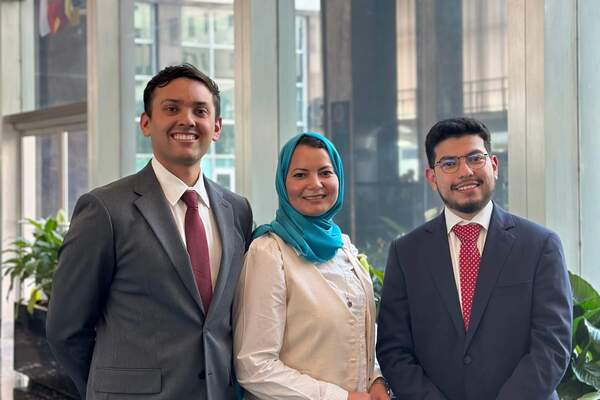Olfa Jelassi, center, says the Keough School's emphasis on  human dignity informs her consulting work.