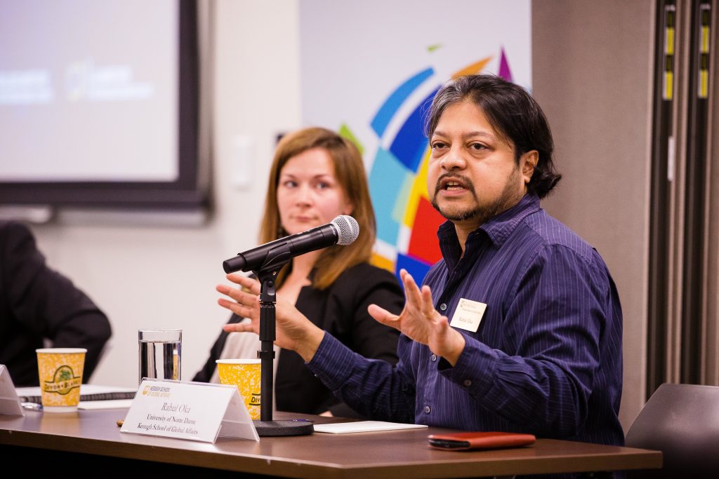 Professor Rahul Oka gestures to the audience while speaking at the South Asia Conference