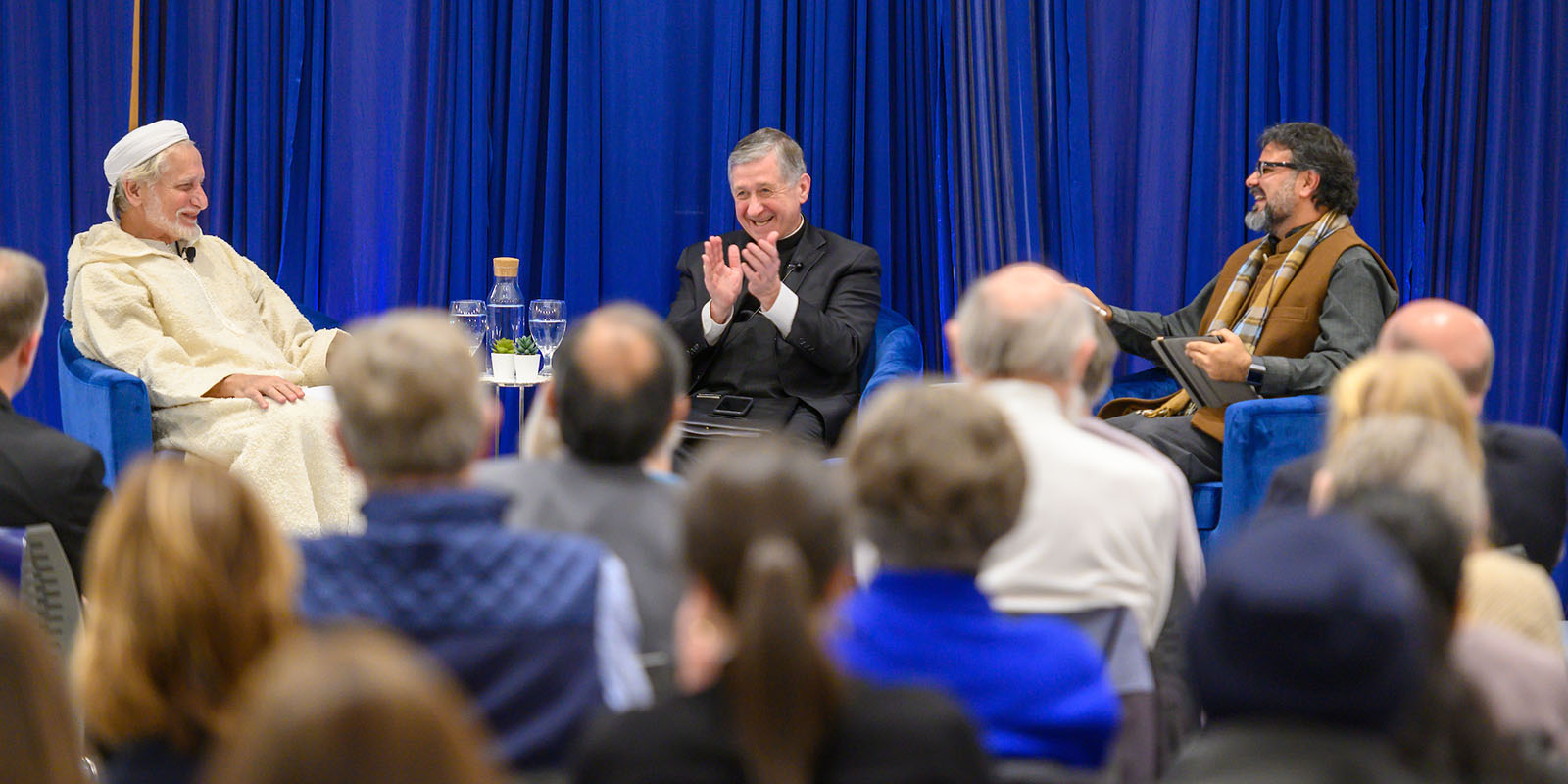 November 20, 2019; (left to right) Daoud Casewit, President of the American Islamic College, Cardinal Blase J. Cupich, Archbishop of Chicago, and moderator Mahan Mirza, executive director for the Rafat and Zoreen Ansari Institute for Global Engagement with Religion take part in a discussion hosted by the Keough School of Global Affairs called "Commemorating the Sultan and the Saint: A Christian-Muslim Dialogue," in the Nanovic Forum. (Photo by Matt Cashore/University of Notre Dame)