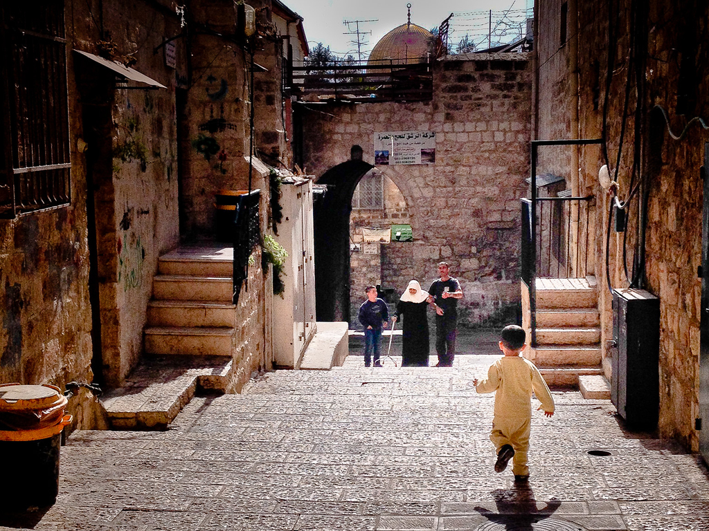 A child runs through a street in Israel