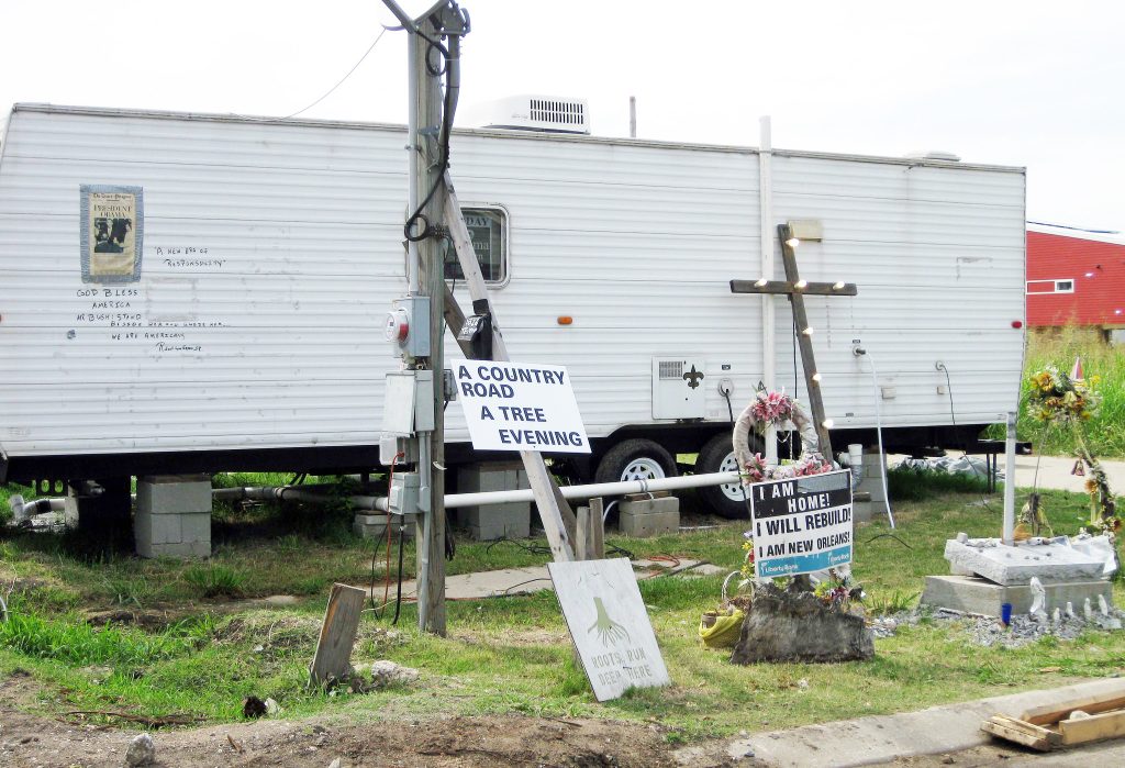 A FEMA trailer surrounded by signs in Louisiana