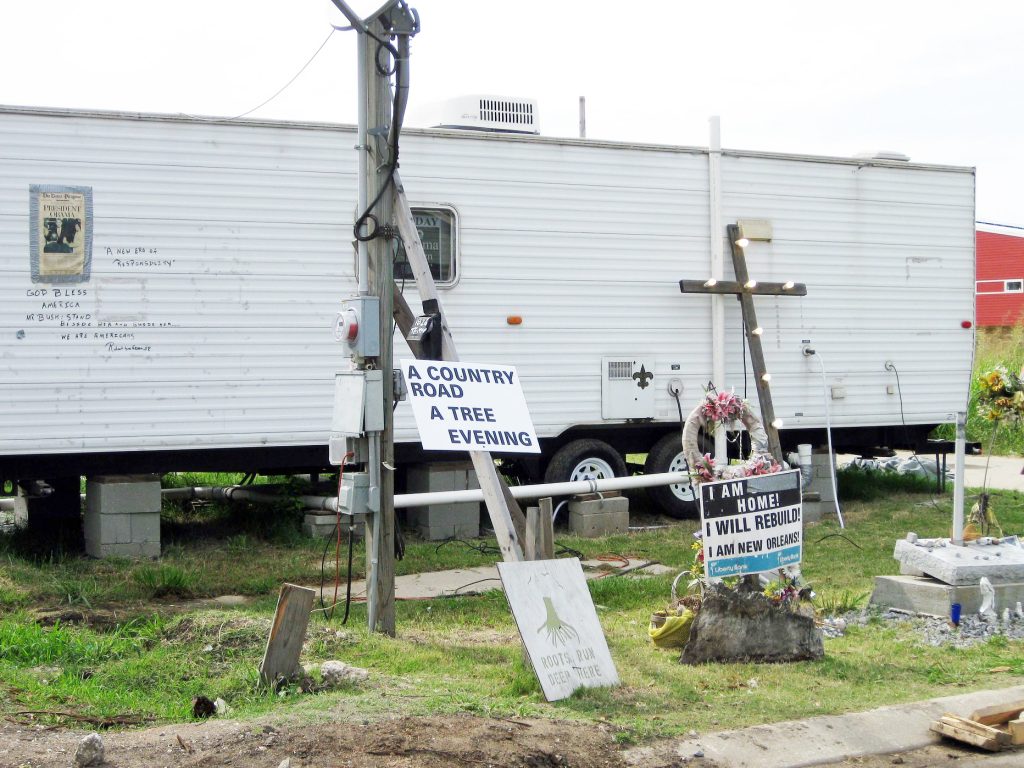 A FEMA trailer surrounded by signs in Louisiana