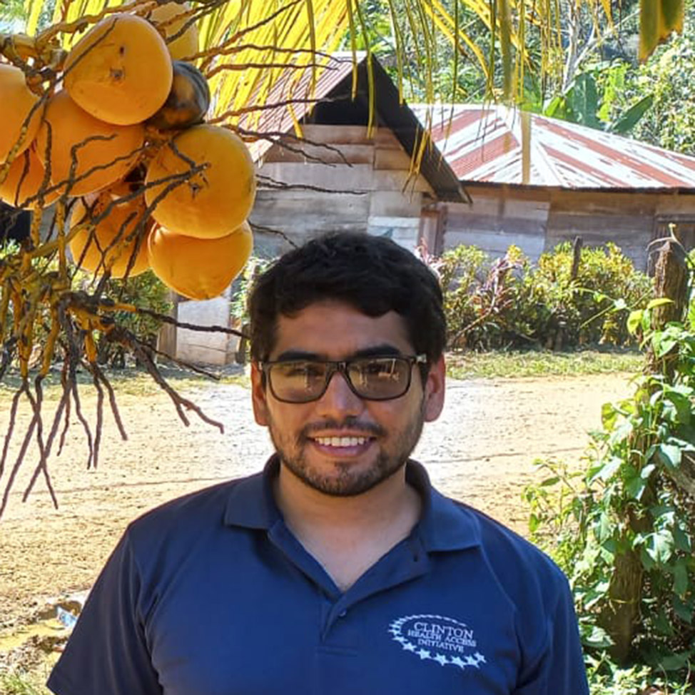 Hugo Flores Navarro standing by mango tree in Guatema;a