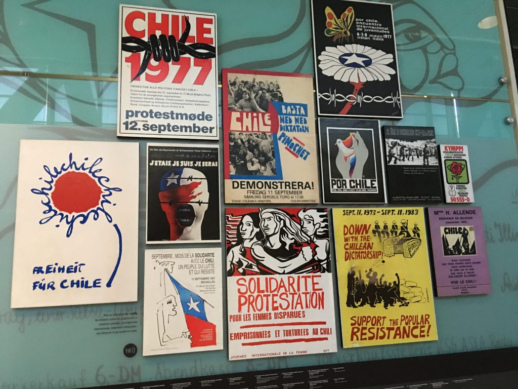 posters protesting human rights violations in Spanish