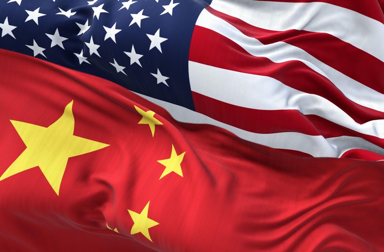 The flags of China and the United States of America waving.