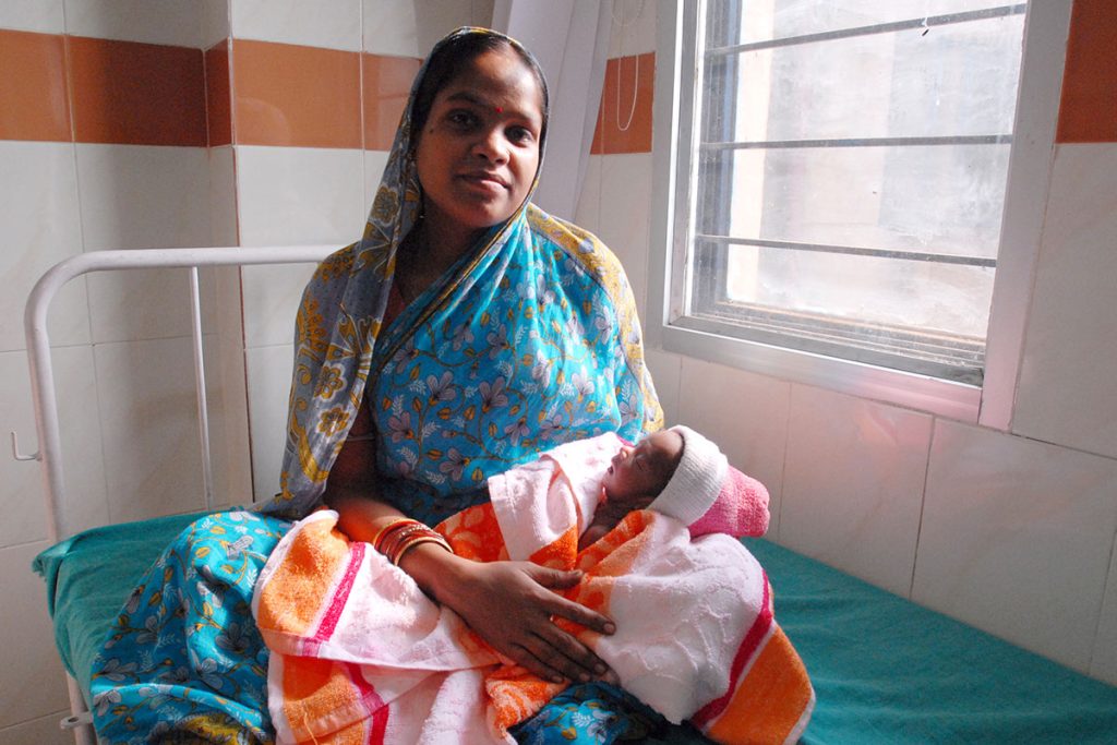 A mother and her newborn child are pictured in Odisha, India. Photo by Pippa Ranger via Flickr.