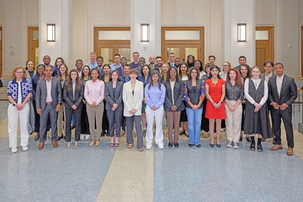 group photo of 42 master of global affairs students with Marilyn Keough dean Mary Gallagher