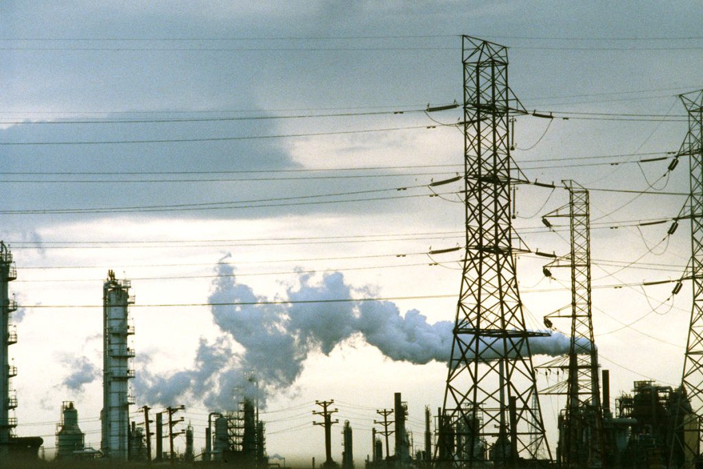 A factory smokestack in New Jersey emits pollutants into the atmosphere.