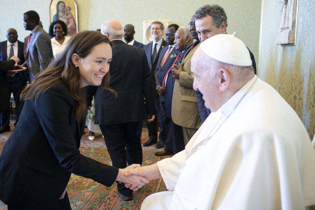 Elizabeth Boyle shaking hands with Pope Francis