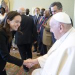 Elizabeth Boyle shaking hands with Pope Francis